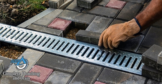Technician installing drainage