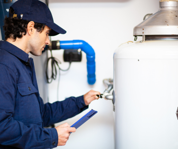 technician checking a water heater