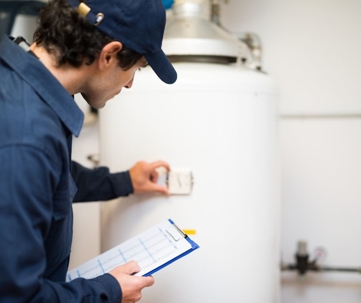 technician checking a water heater